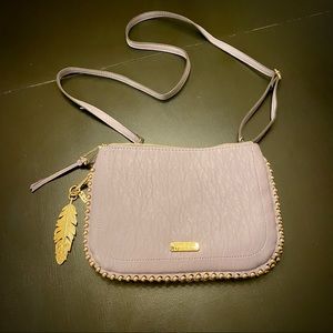 Purple with gold beads around outside. Jessica Simpson. Never used